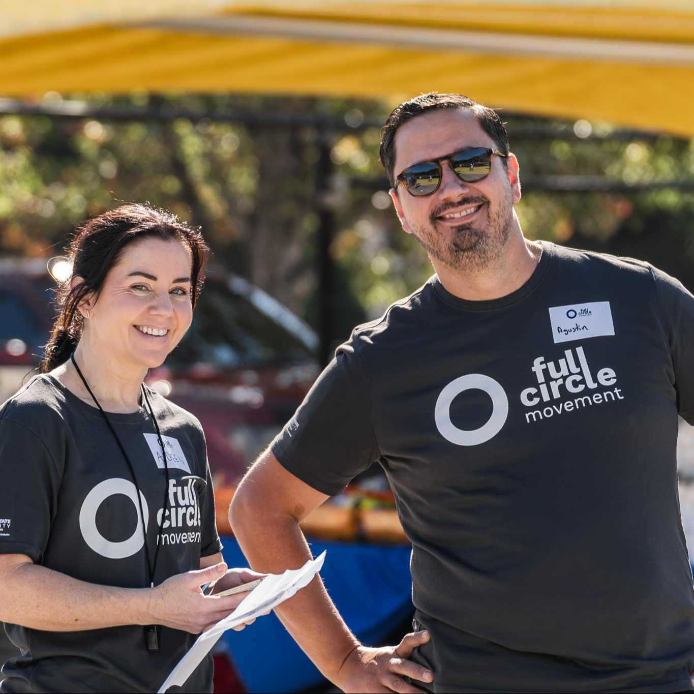 Full Circle Movement event volunteers posing for a picture while on duty