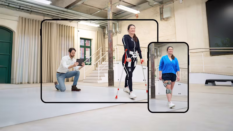 Medizinische Fachkraft nimmt eine Frau beim Gehen mit Exopulse Suit und L300 Go auf.