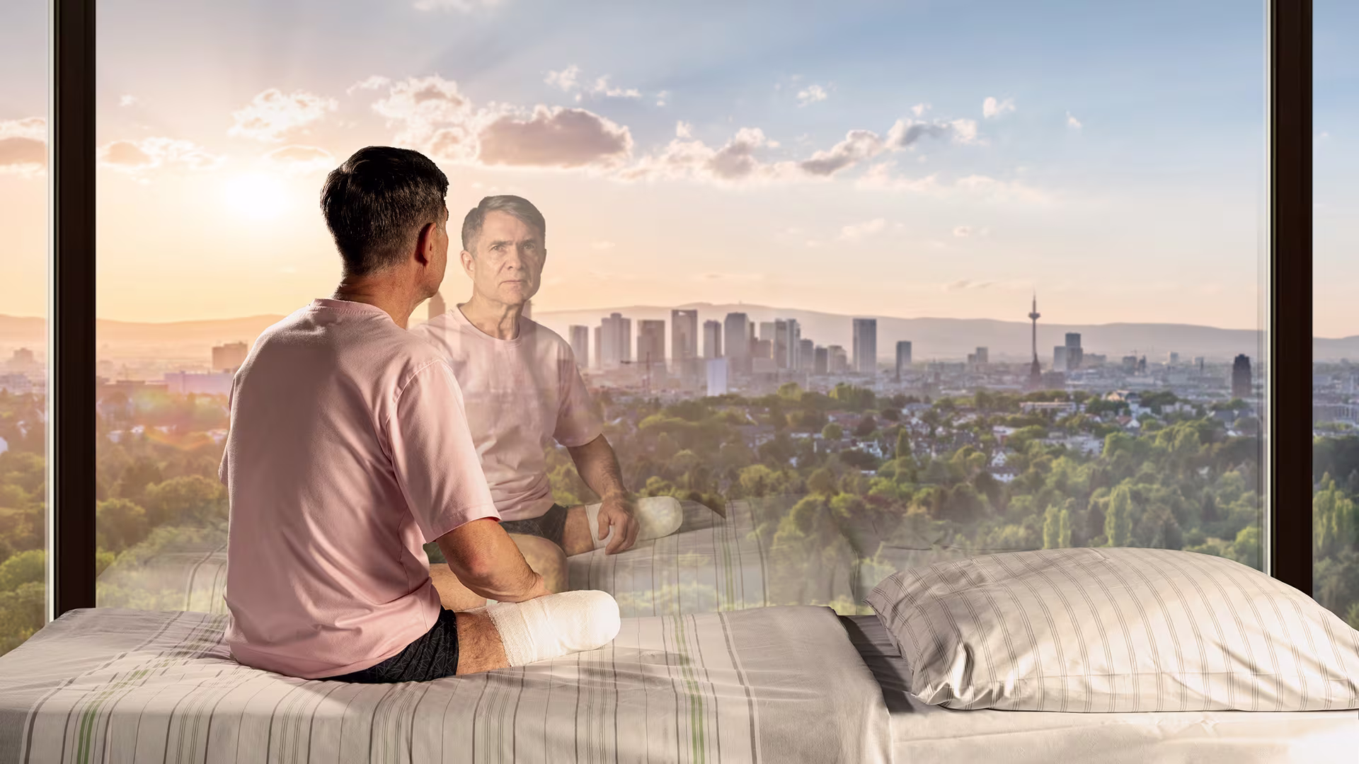 Man after amputation looks out of window