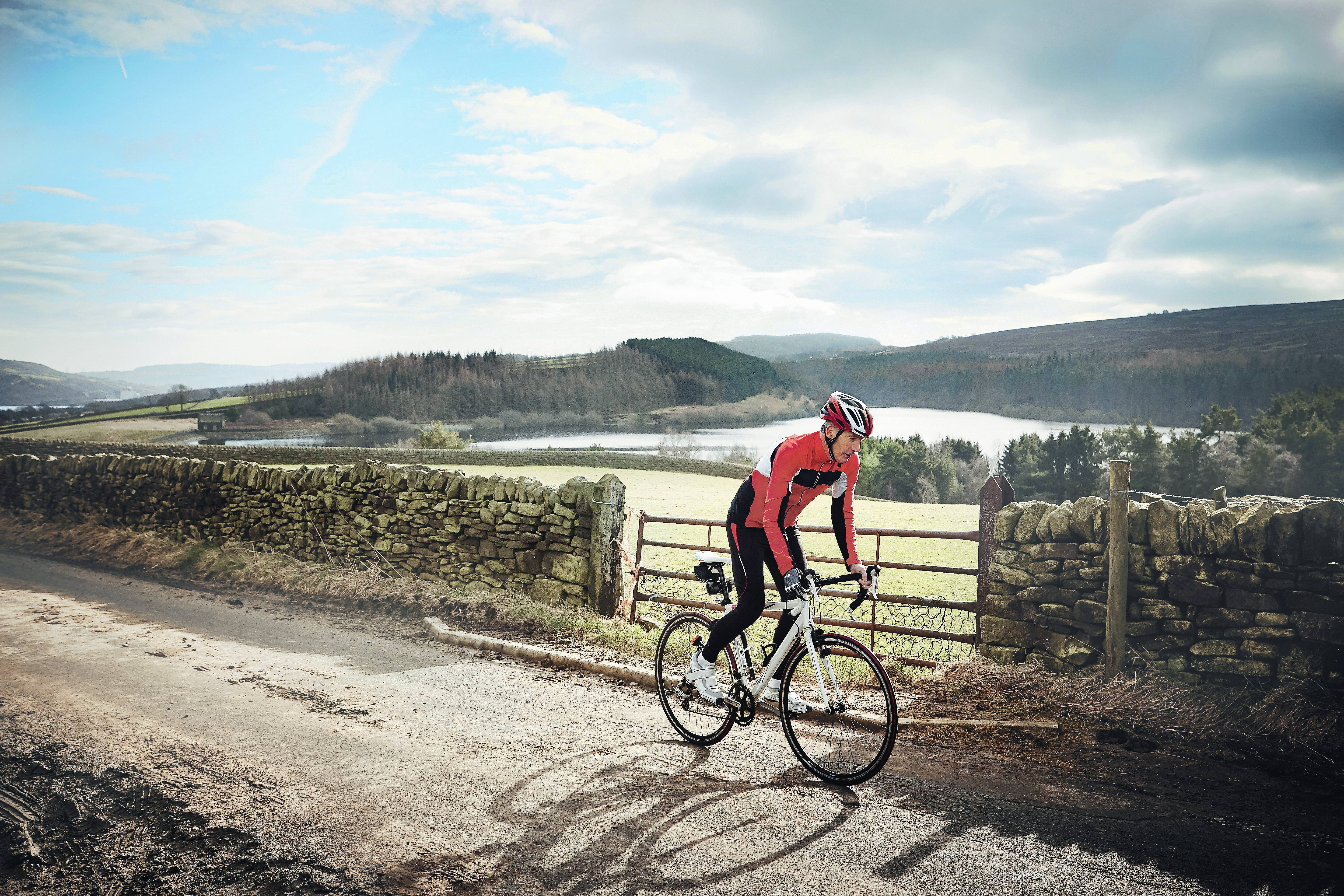A cyclist riding through an outdoor trail
