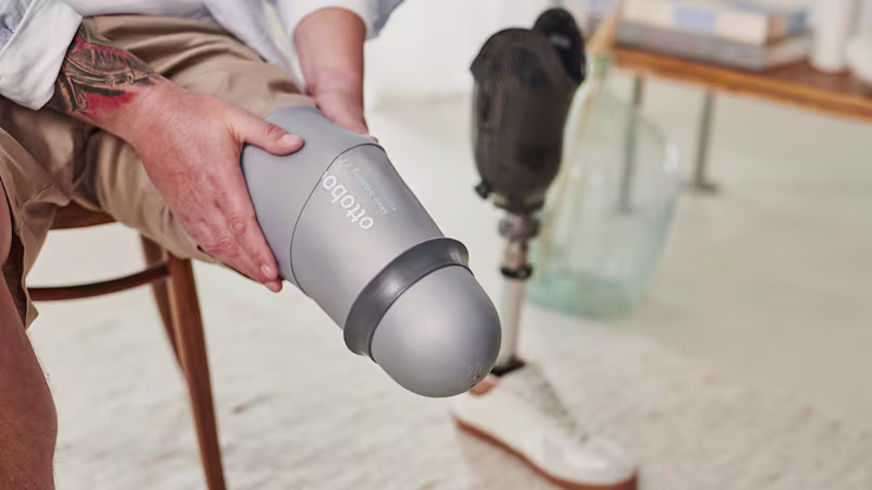 A below knee amputee adjusting their skeo sealing prosthetic liner on their residual limb