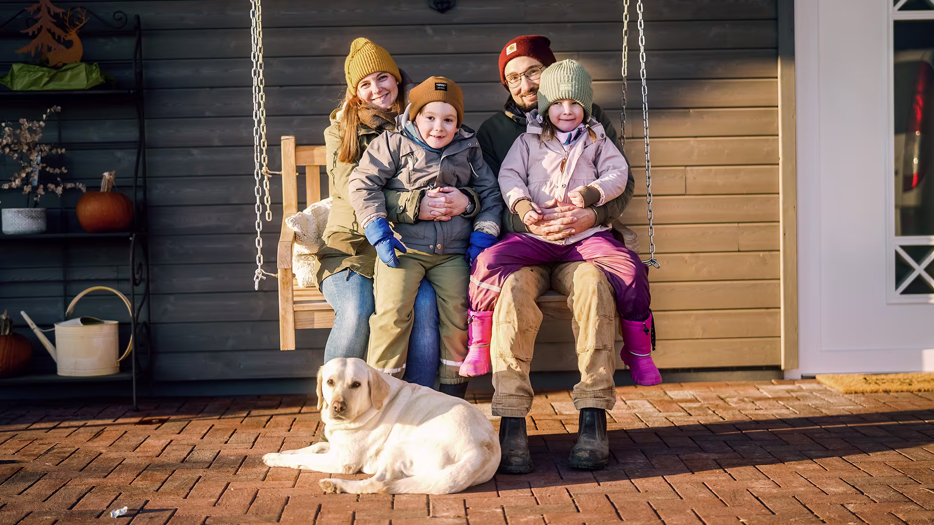Family with Cerebral palsy child sitting on swing