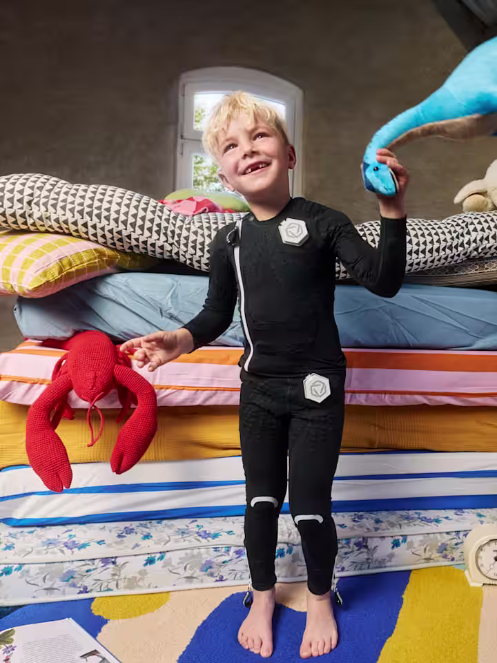 Family with Cerebral palsy child sitting on swing