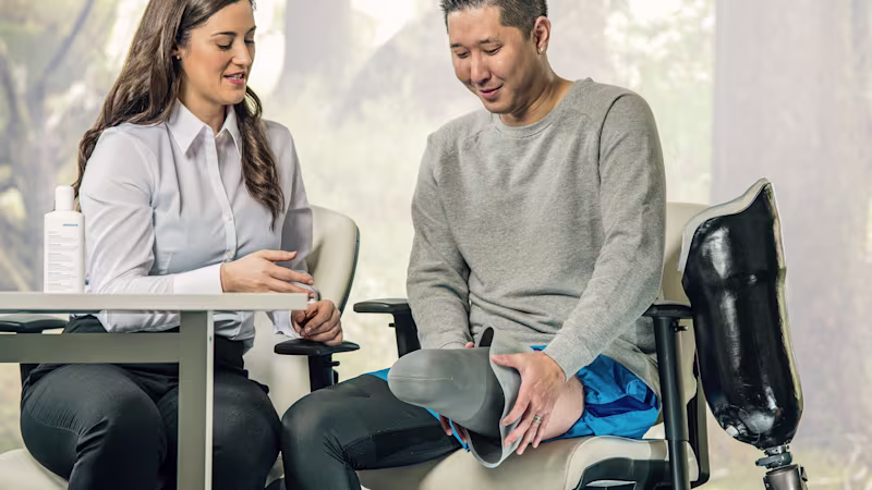 A Certified Prosthetist (CP) with a lower limb prosthetic user to discuss prosthetic limb options