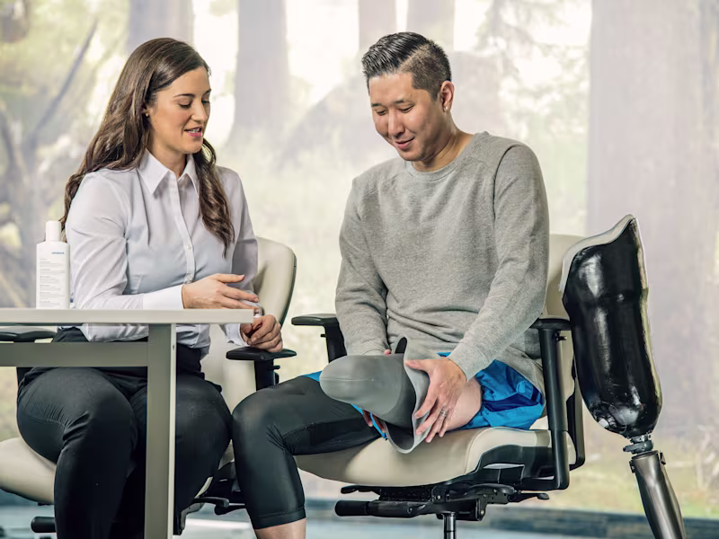 A Certified Prosthetist (CP) with a lower limb prosthetic user to discuss prosthetic limb options