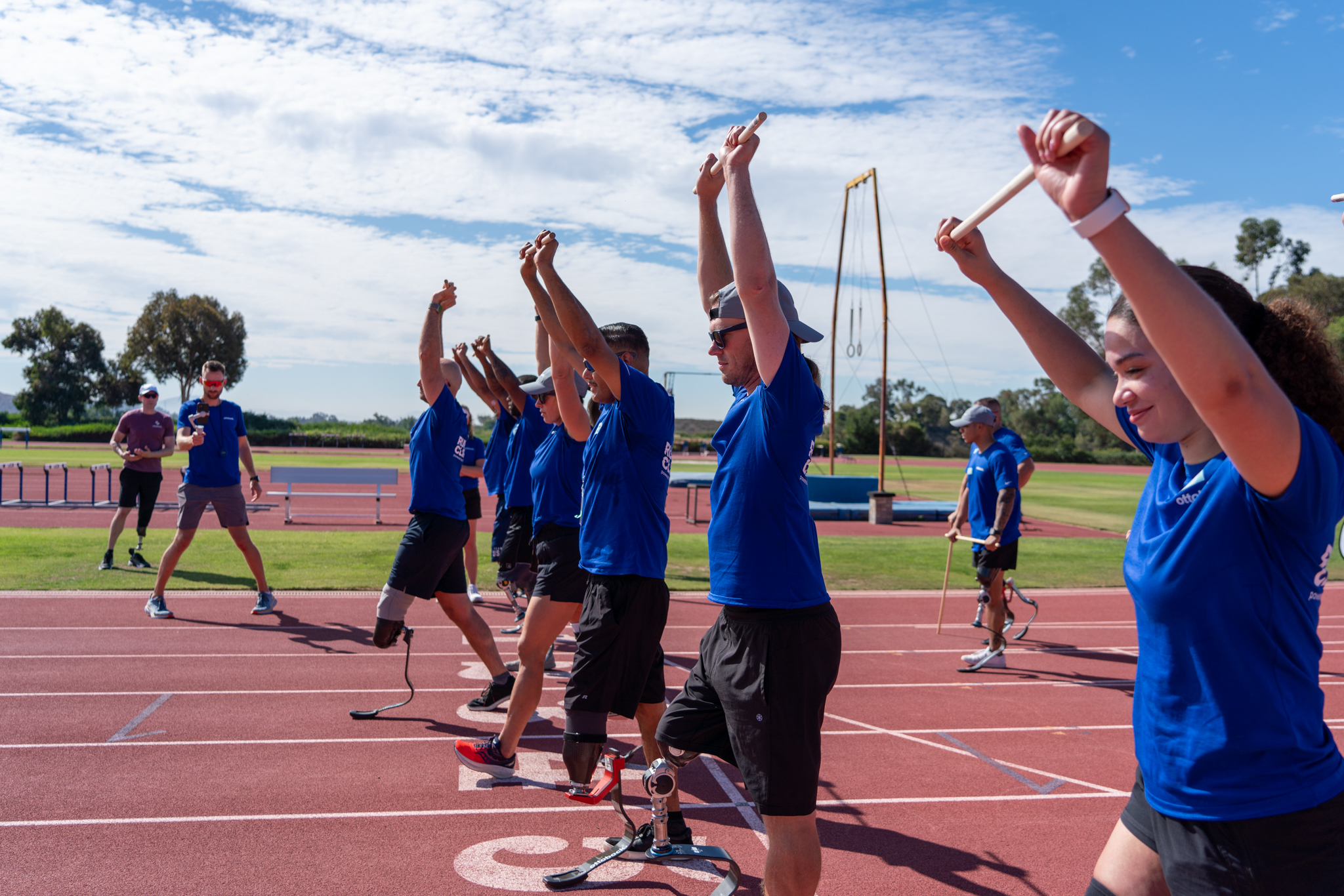 A group of amputees warming up before partaking in the Ottobock North America Running Clinic