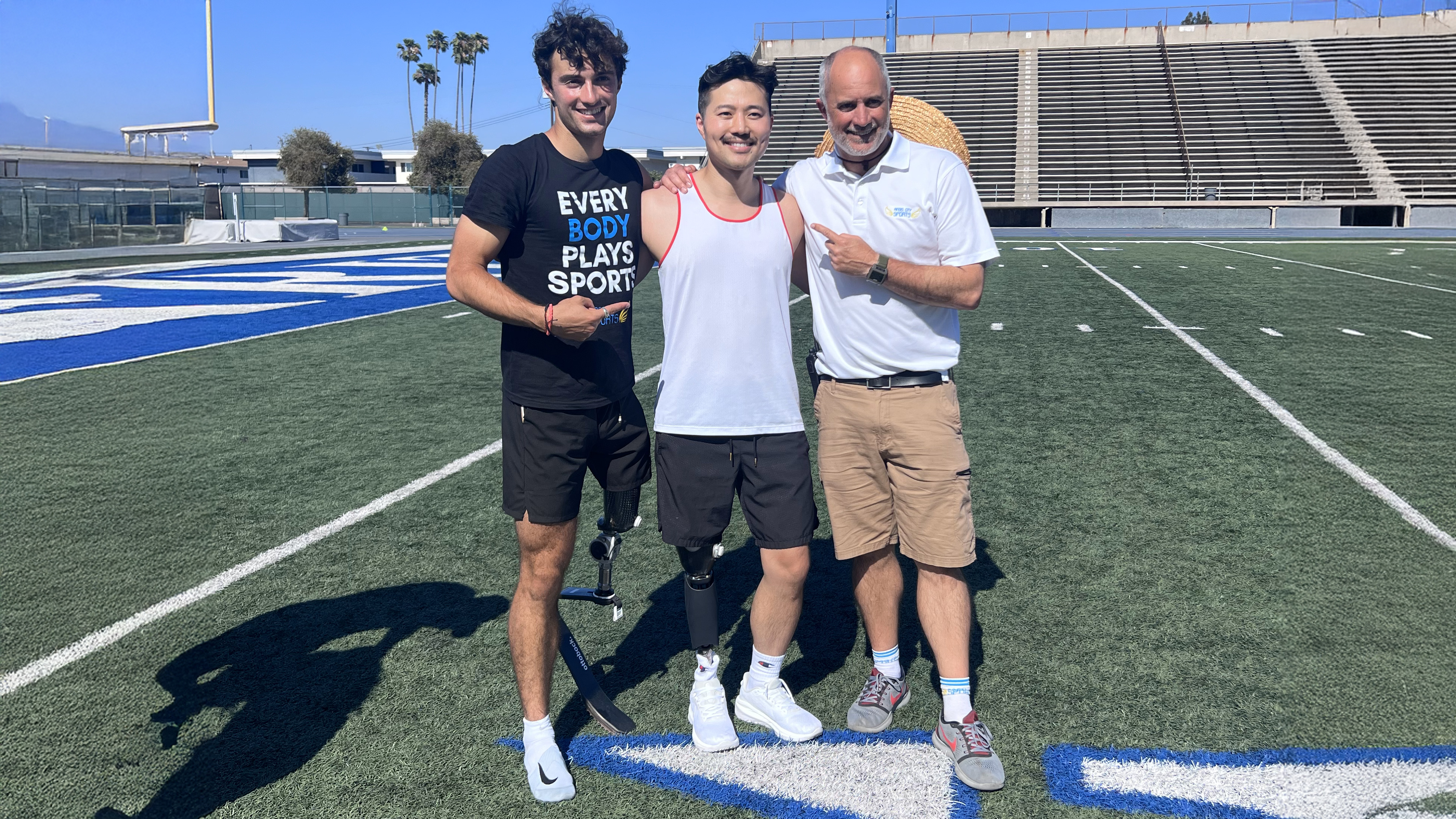 Paralympian Ezra Frech posing with Full Circle Movement event attendees