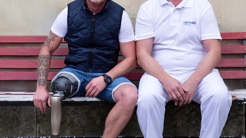 Laszlo and CPO sitting on a bank