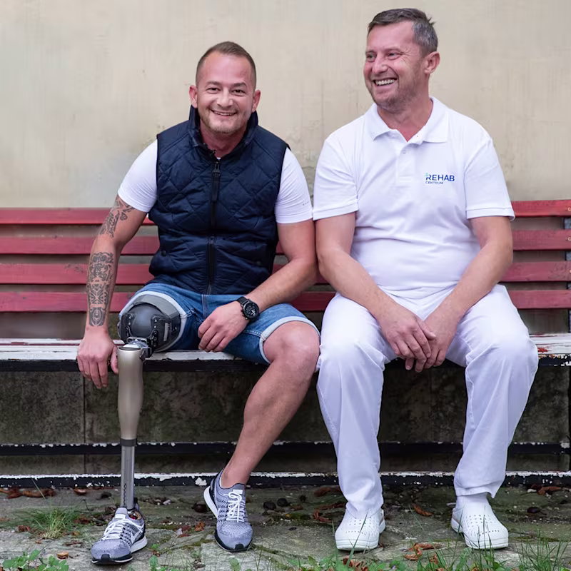 Laszlo and CPO sitting on a bank