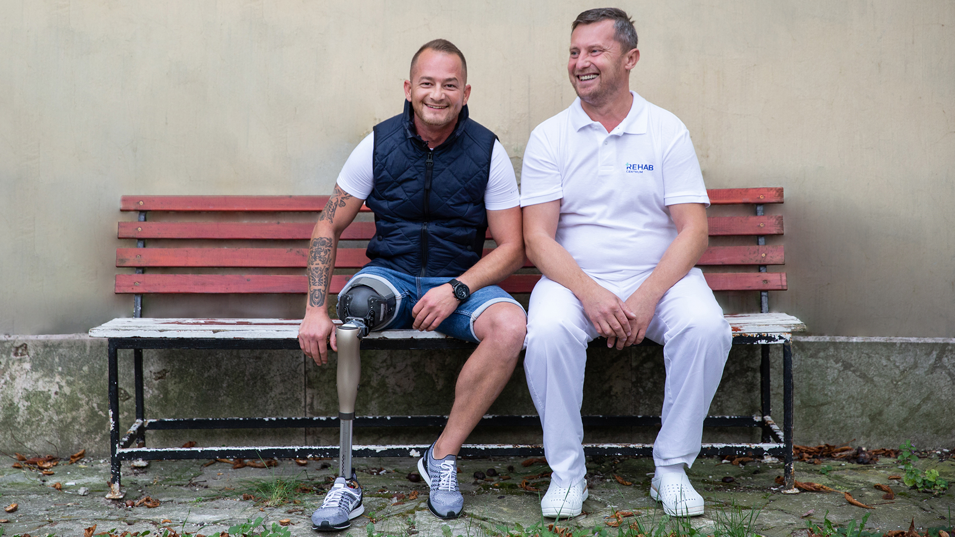 Laszlo and CPO sitting on a bank