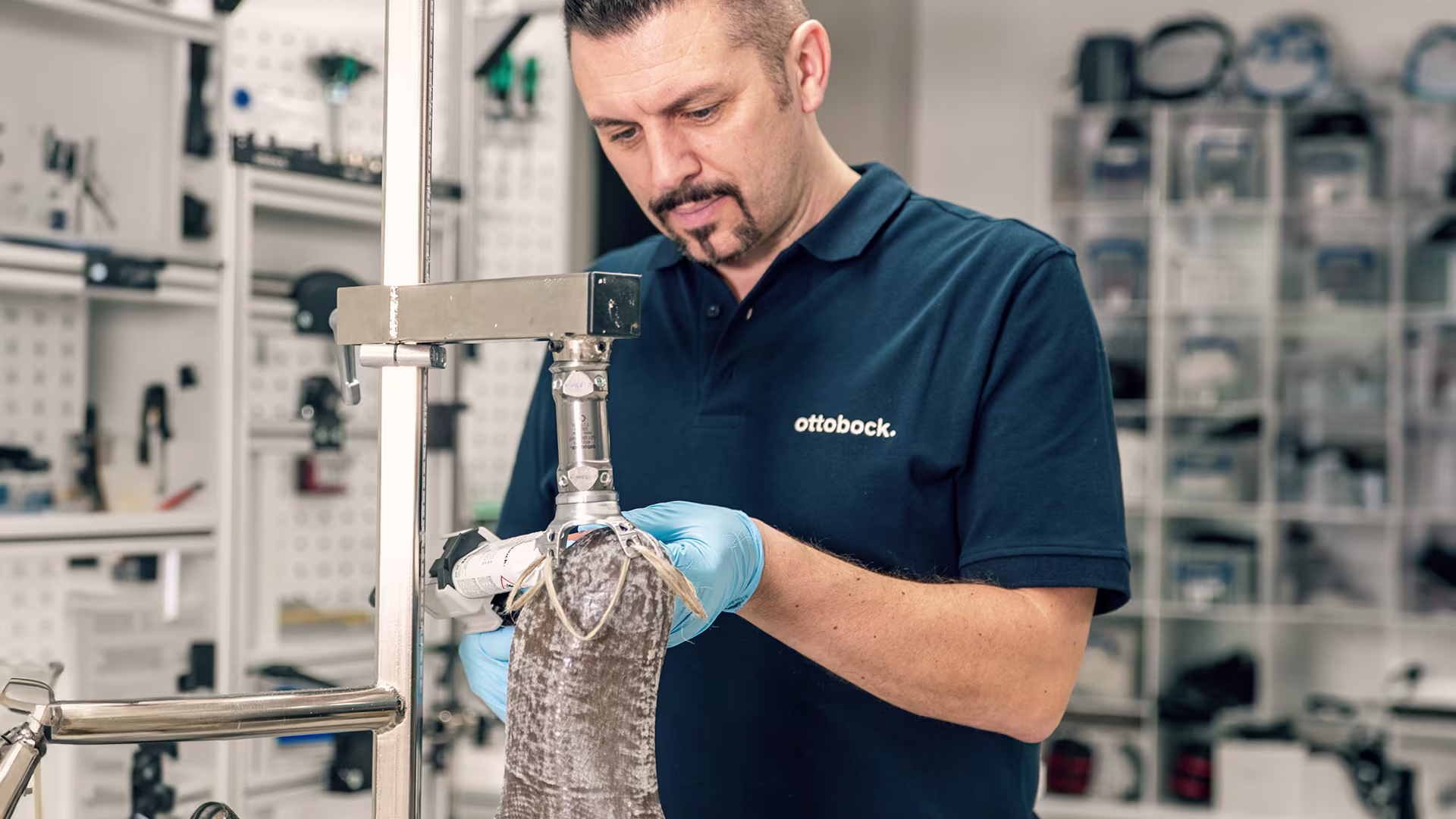 Ottobock technician fixing lamination anchor on socket using SuperGlue.