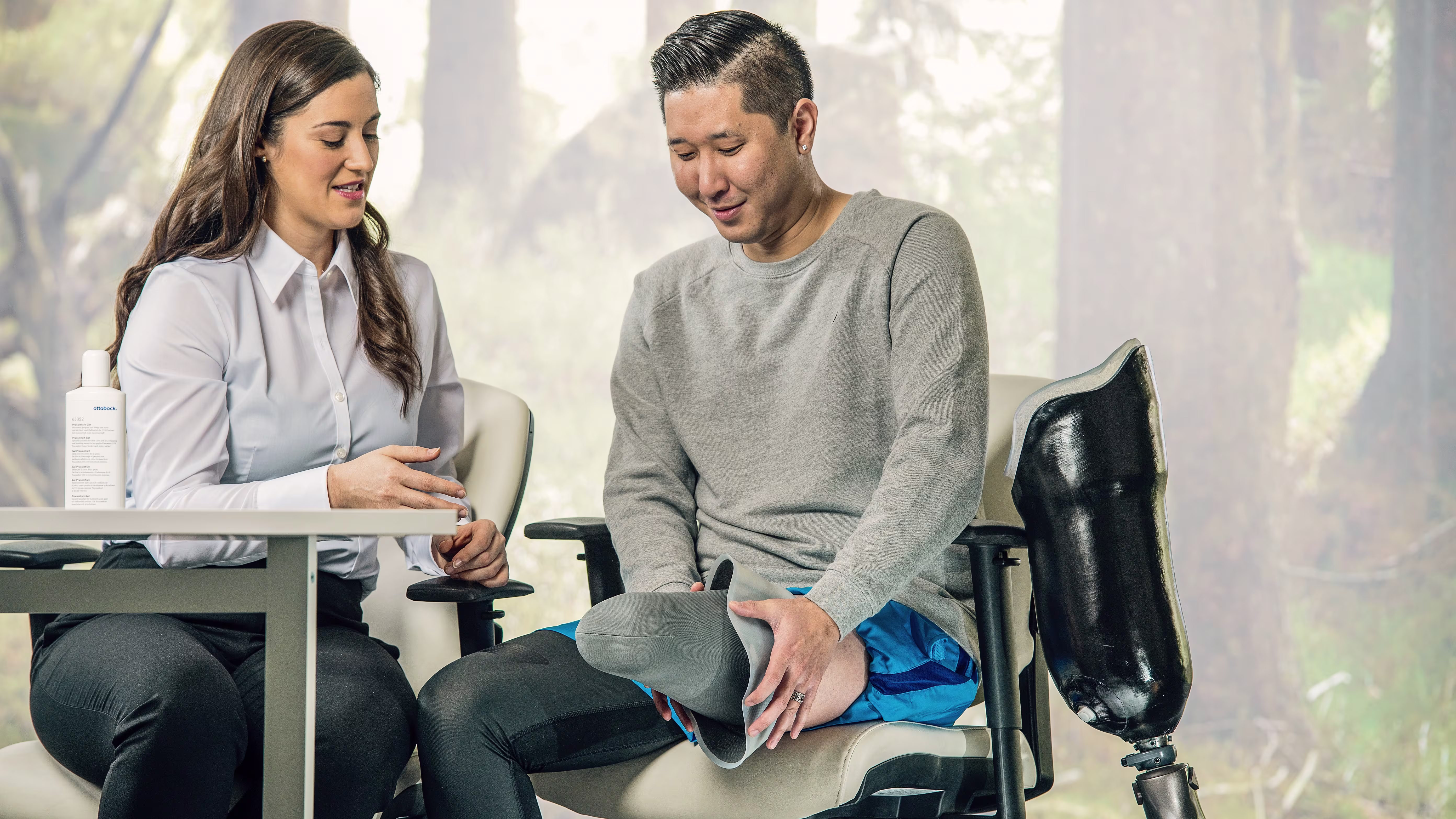 A Certified Prosthetist Orthotist consulting with a lower extremity amputee on prosthetic leg options
