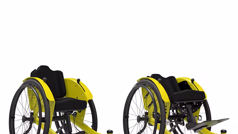 Sarı yan panelli, siyah döşemeli ve tekerlekli kidevo mini tekerlekli sandalye modeli.