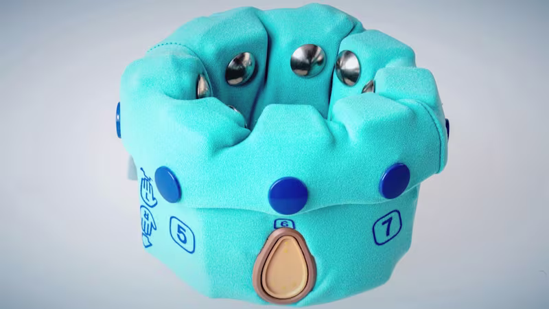 A picture of Ottobock's myosmart cuff on a bright white background. A teal, cloth-covered device made to fit around the arm with metallic circles that touch the patient's skin to measure myoelectric signals