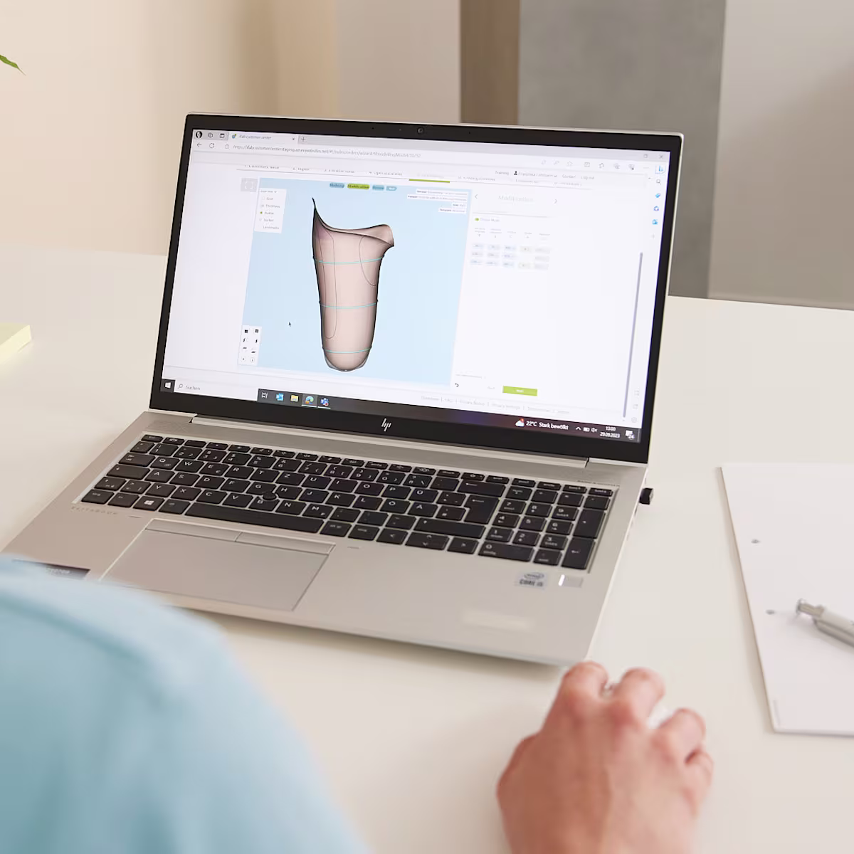 A Prosthetic Practitioner working in Ottobock software to order custom prosthetics for their patient