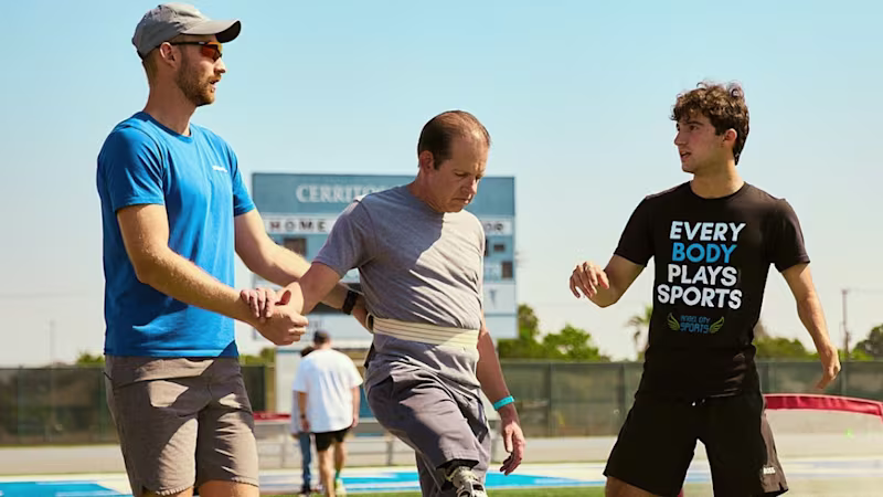 Angel City Games co-founder Ezra Frech and Head Coach of Full Circle Movement Lucas Crisanti working with a attendee