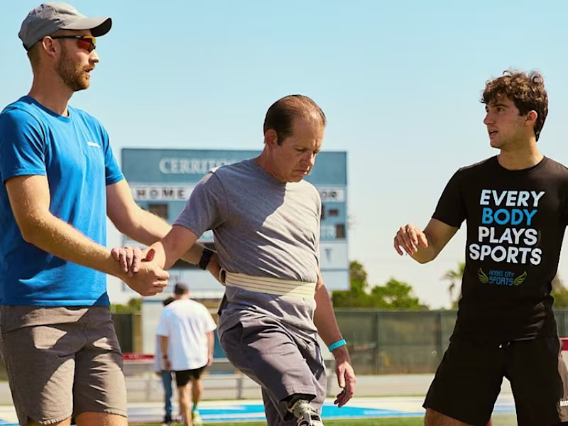 Angel City Games co-founder Ezra Frech and Head Coach of Full Circle Movement Lucas Crisanti working with a attendee