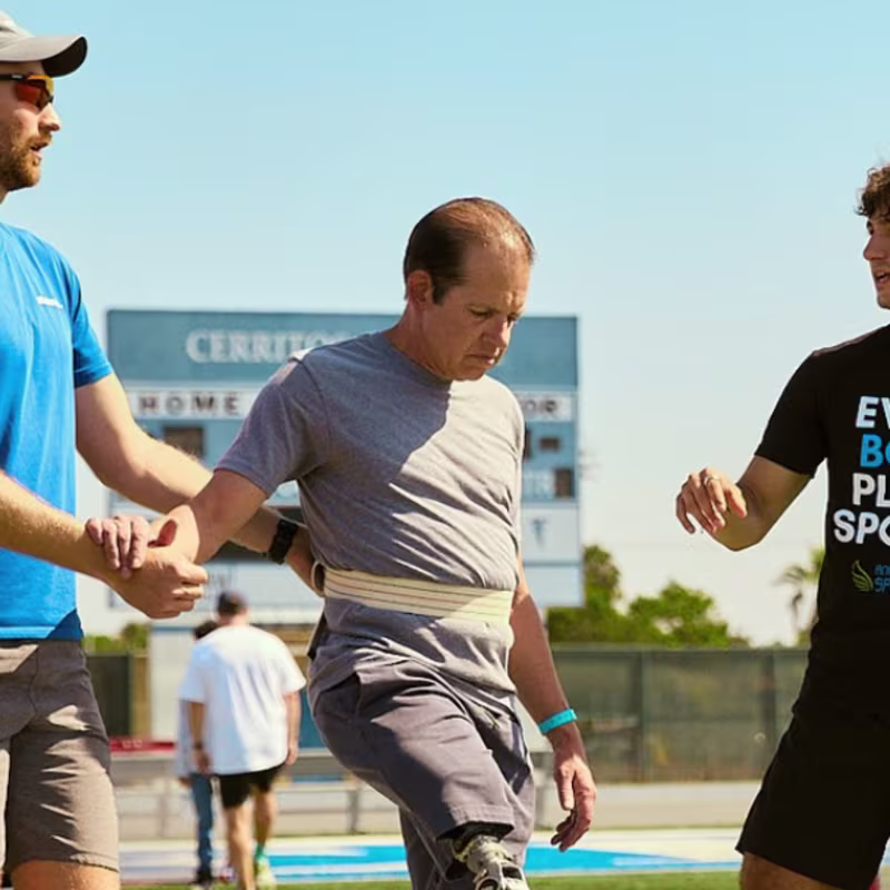 Angel City Games co-founder Ezra Frech and Head Coach of Full Circle Movement Lucas Crisanti working with a attendee