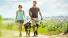 A man wearing a C-Leg 4 walks his dog next to a woman