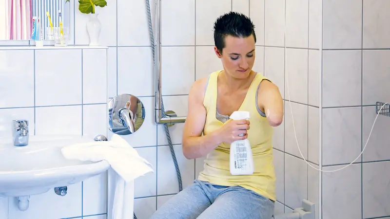 An amputee cleans their residual limb