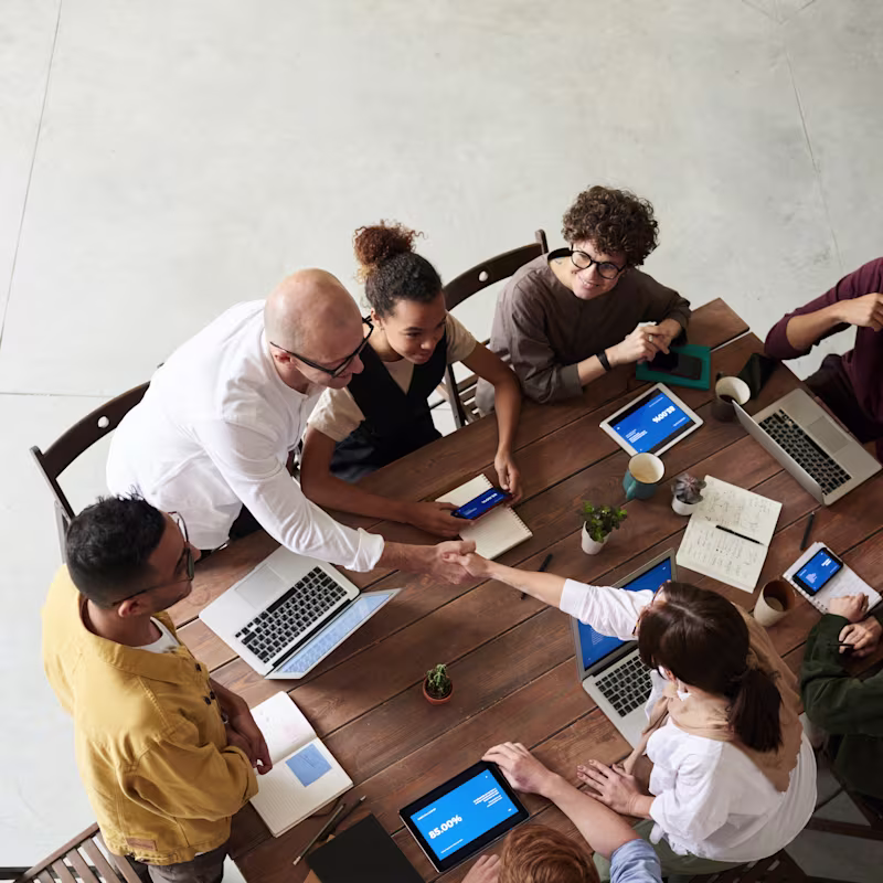A work team celebrating during a meeting