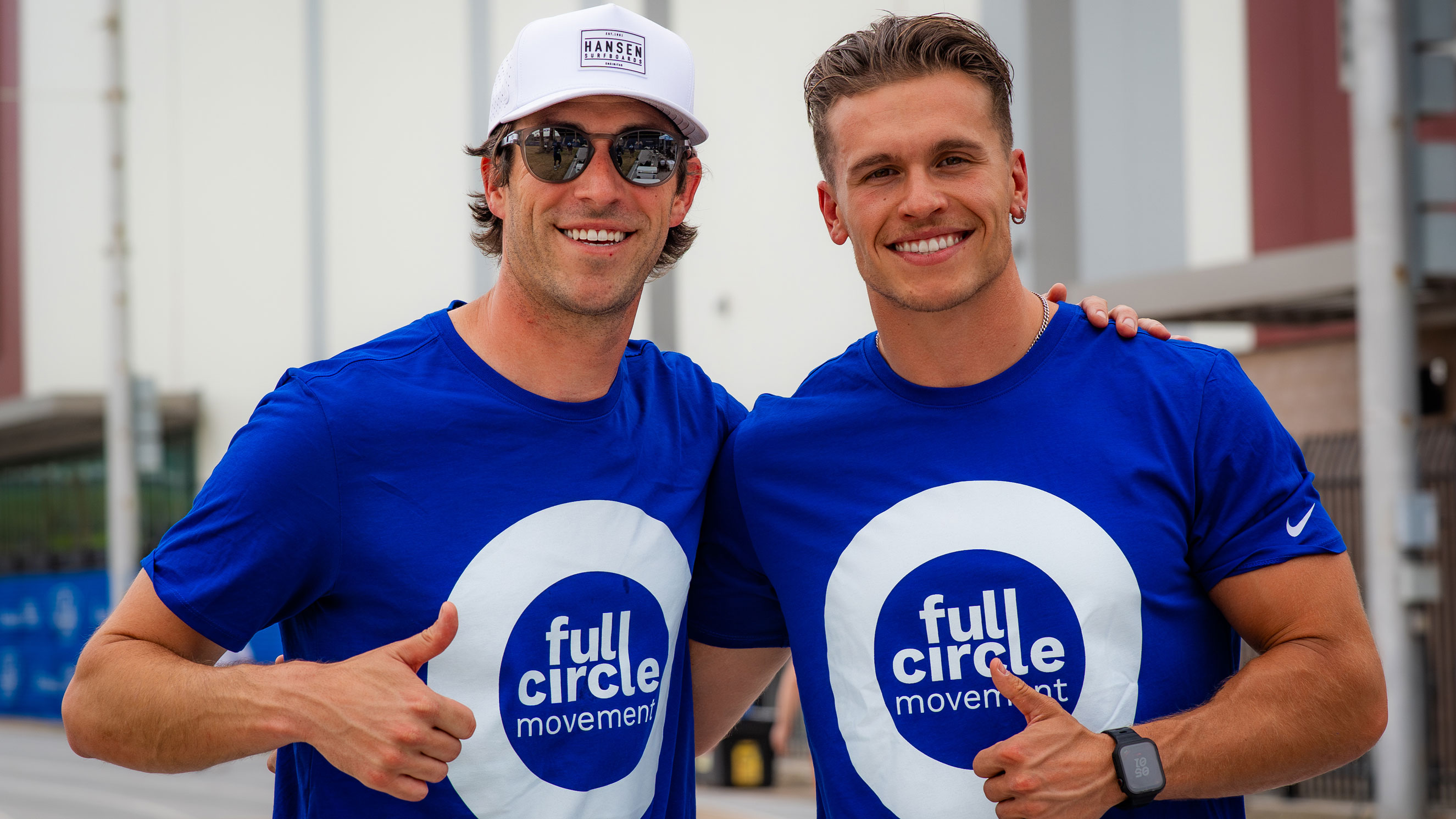 Full Circle Movement attendees hugging and posing for the camera