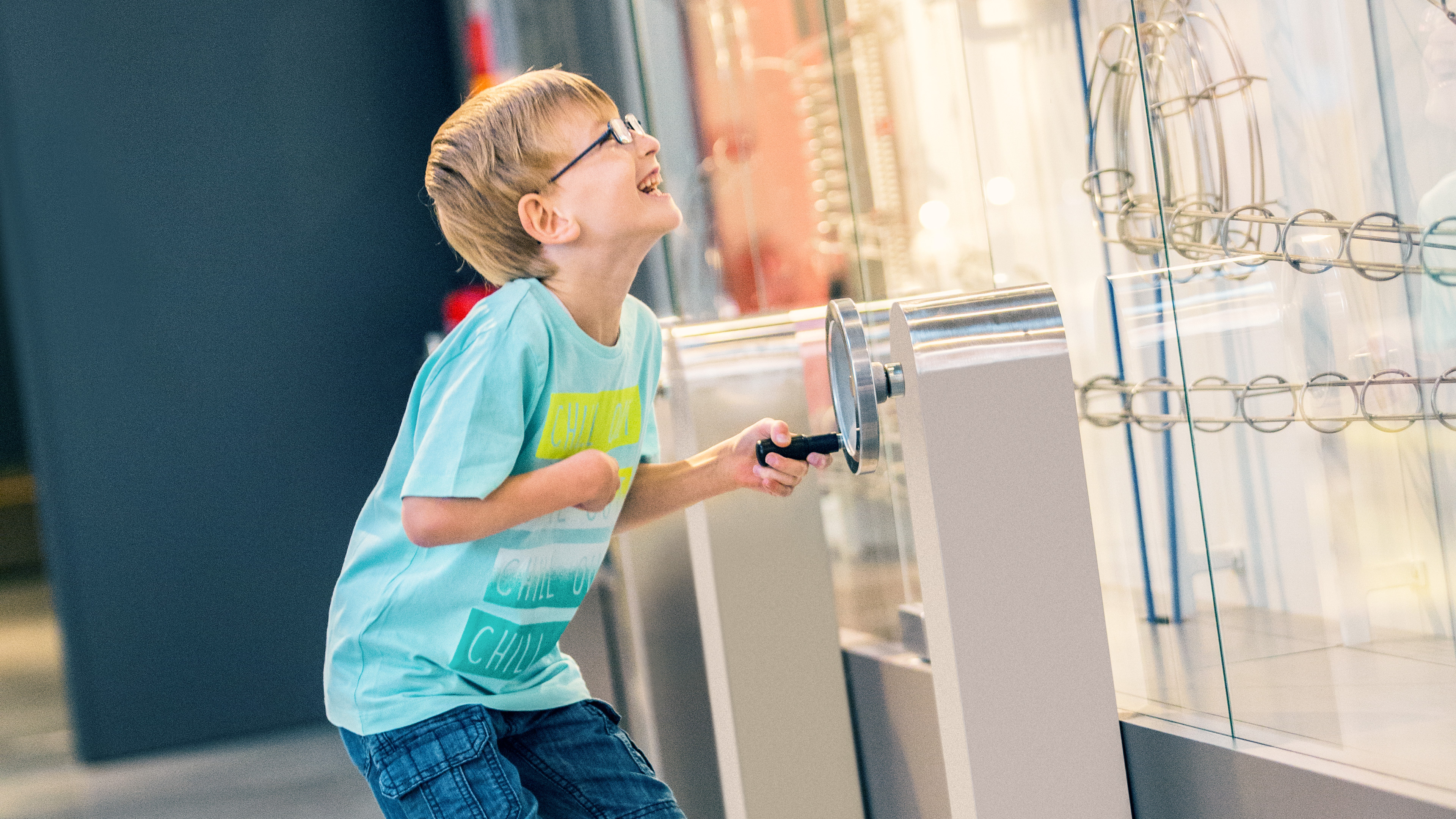 Leo turns a crank and is happy