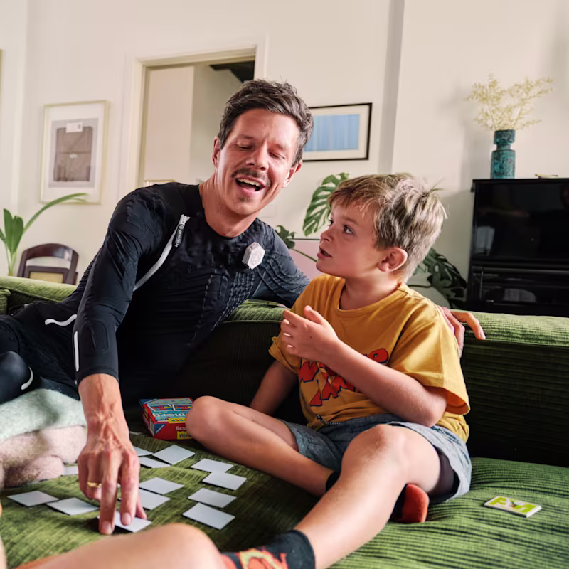 Ottobock user Ricky plays with his children wearing the exopulse suit.