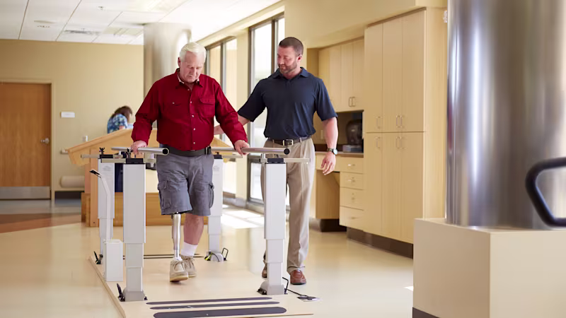 Prosthetic user during gait training indoor