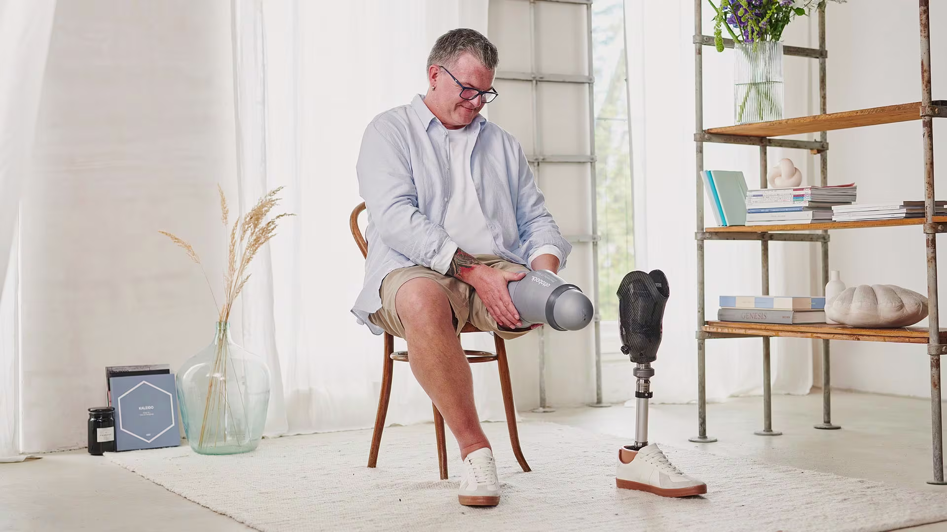 A transtibial amputee putting on his Skeo Sealing TT prosthetic liner