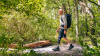 A male user is walking in the forest with his Taleo Harmony prosthetic foot.