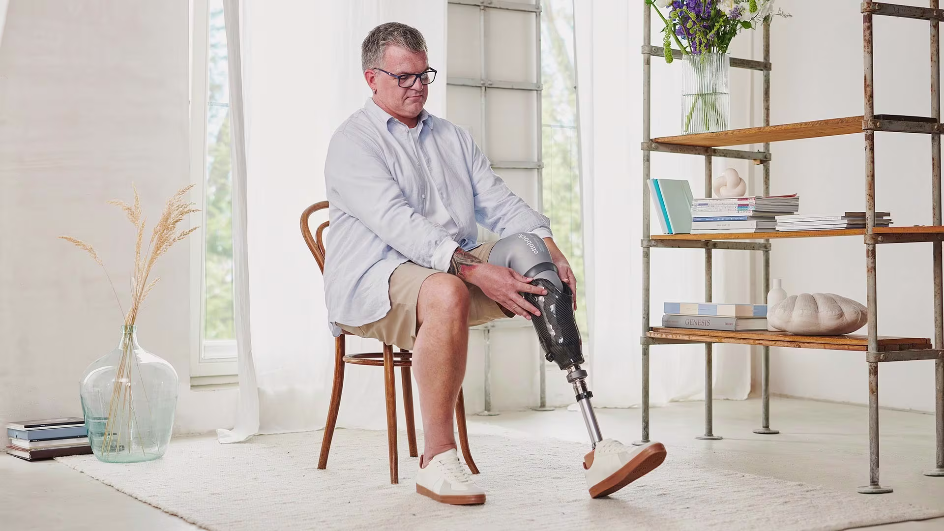 A prosthetic leg user placing his prosthetic socket on his residual limb