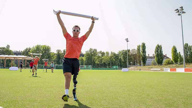 An amputee athlete celebrates a victory
