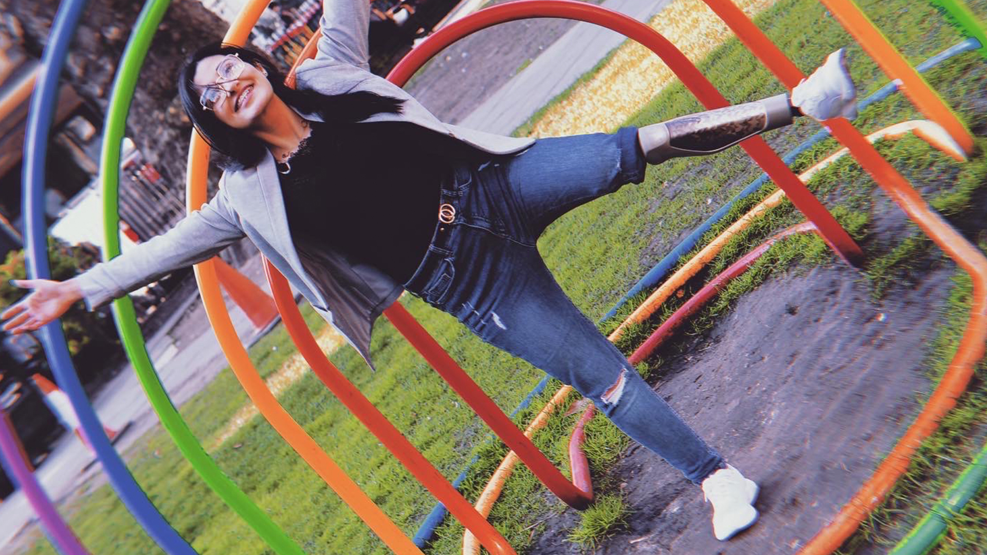 Dima poses exuberantly in front of an outdoor sculpture in her C-Leg 4
