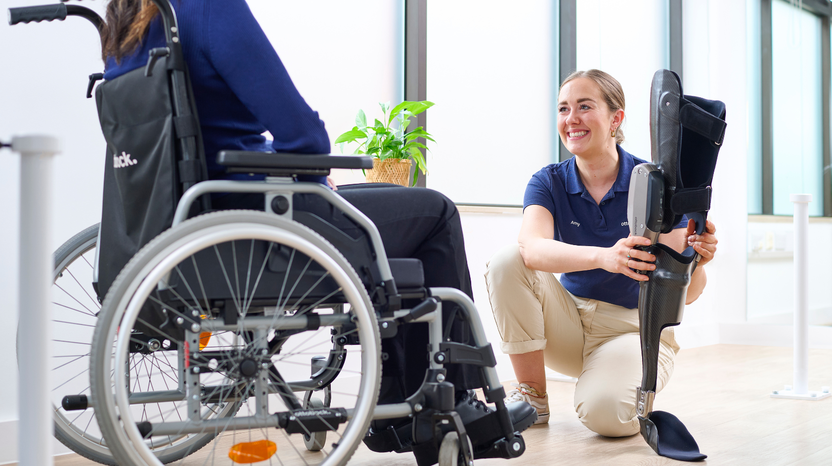 Ottobock UK Academy Clinician Amy McColm holding a C-Brace orthosis.