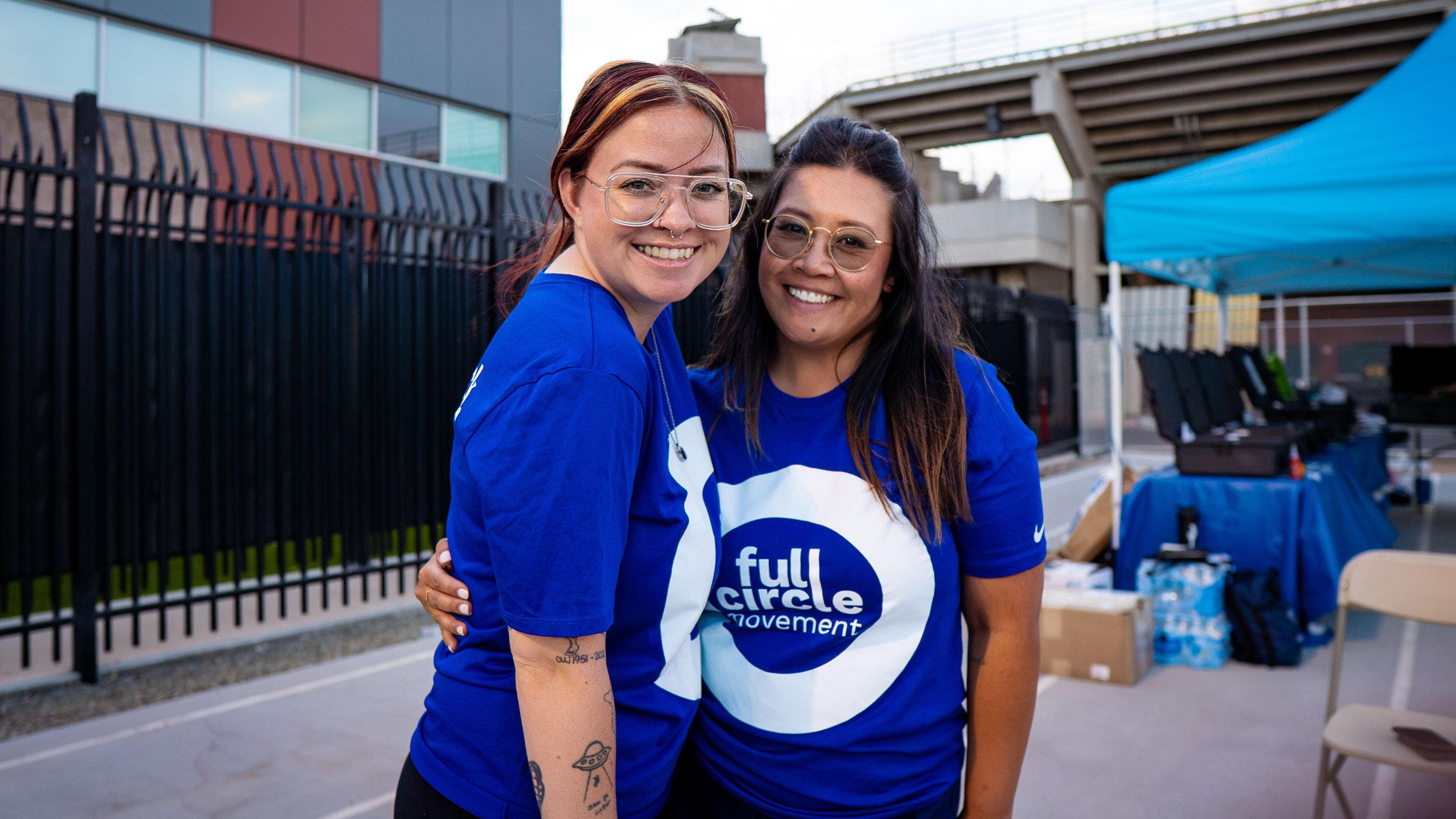Participants of Full Circle Movement hug and pose for the camera