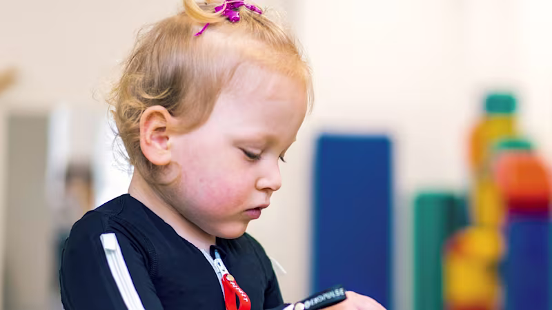 Cerebral palsy patient playing with her physiotherapist