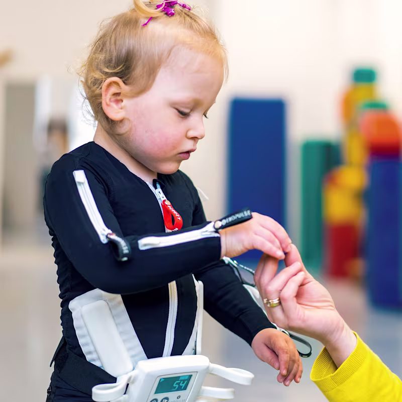 Cerebral palsy patient playing with her physiotherapist