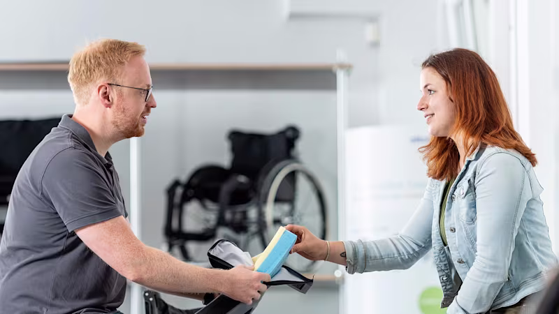 A user is advised on suitable wheelchairs by qualified personnel at the Bad Oeyhausen workshop.