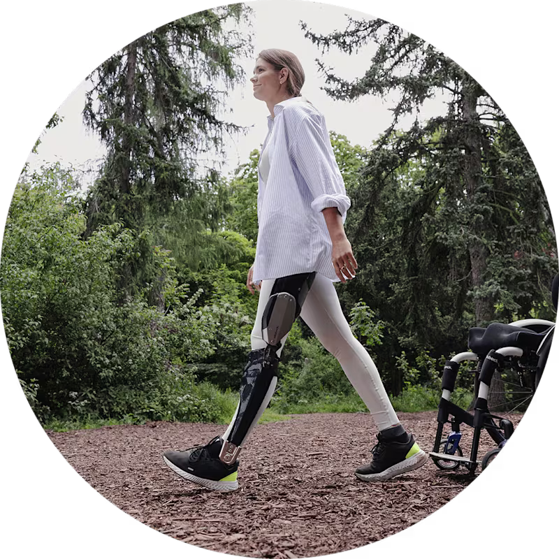 C-Brace user walking away from her manual wheelchair