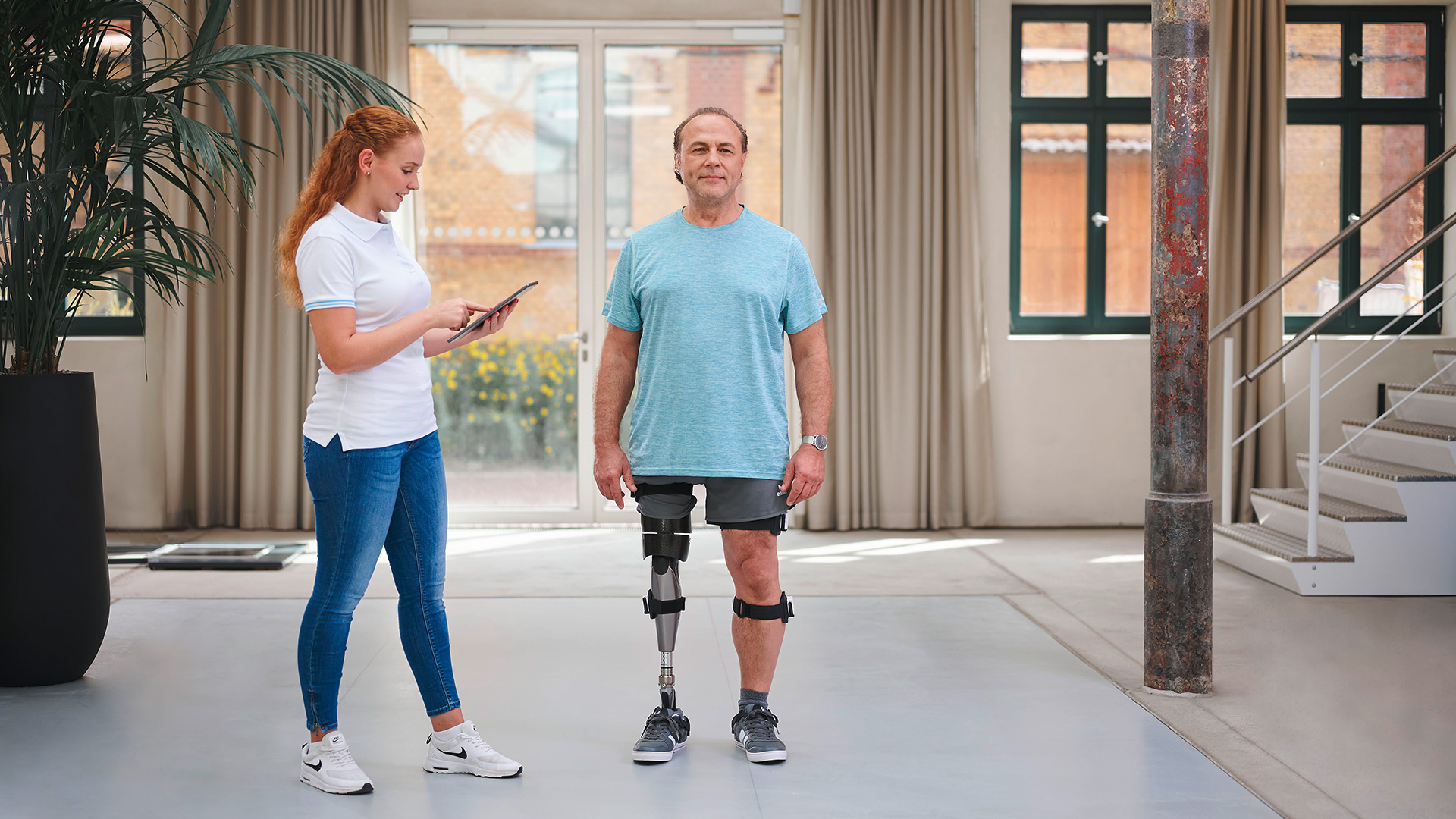 A C-Leg prosthetic leg user trialing the product with a Certified Prosthetist supervising