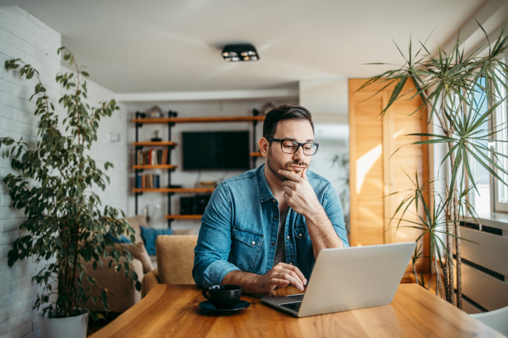 portrait-of-a-casual-businessman-thinking-while-lo-2022-12-18-17-25-17-utc