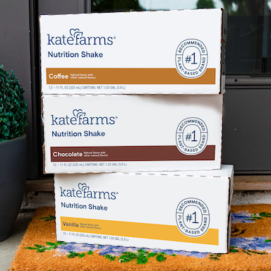 3 boxes of Kate Farms coffee, chocolate, and vanilla nutrition shakes stacked