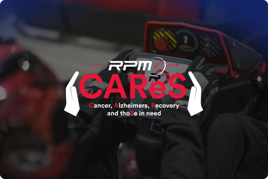 A person wearing gloves grips the steering wheel of a go-kart. Overlaid text reads "RPM CAReS" with a heartbeat line, and below it "Cancer, Alzheimers, Recovery and those in need." The image background is blurred, emphasizing the text and steering wheel.