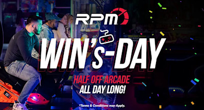 A woman and a man are smiling and playing arcade games with bright lights and colorful arcade machines in the background. The text overlay reads, "RPM Race Play More WIN's-DAY Half Off Arcade All Day Long! Terms & Conditions May Apply." Confetti is scattered in the image.