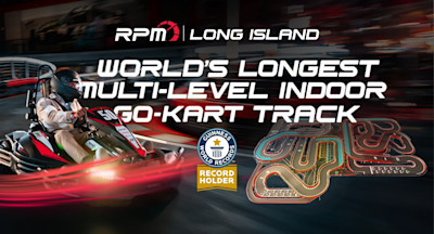 Racer driving a red and black go-kart at RPM Long Island alongside graphics promoting the Guinness World Records title for the world’s longest multi-level indoor go-kart track, with a track layout map displayed.