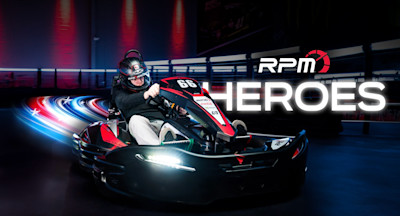 Two go karts on a go kart track with a rider waiving at the camera and the text RPM Heroes imposed over.