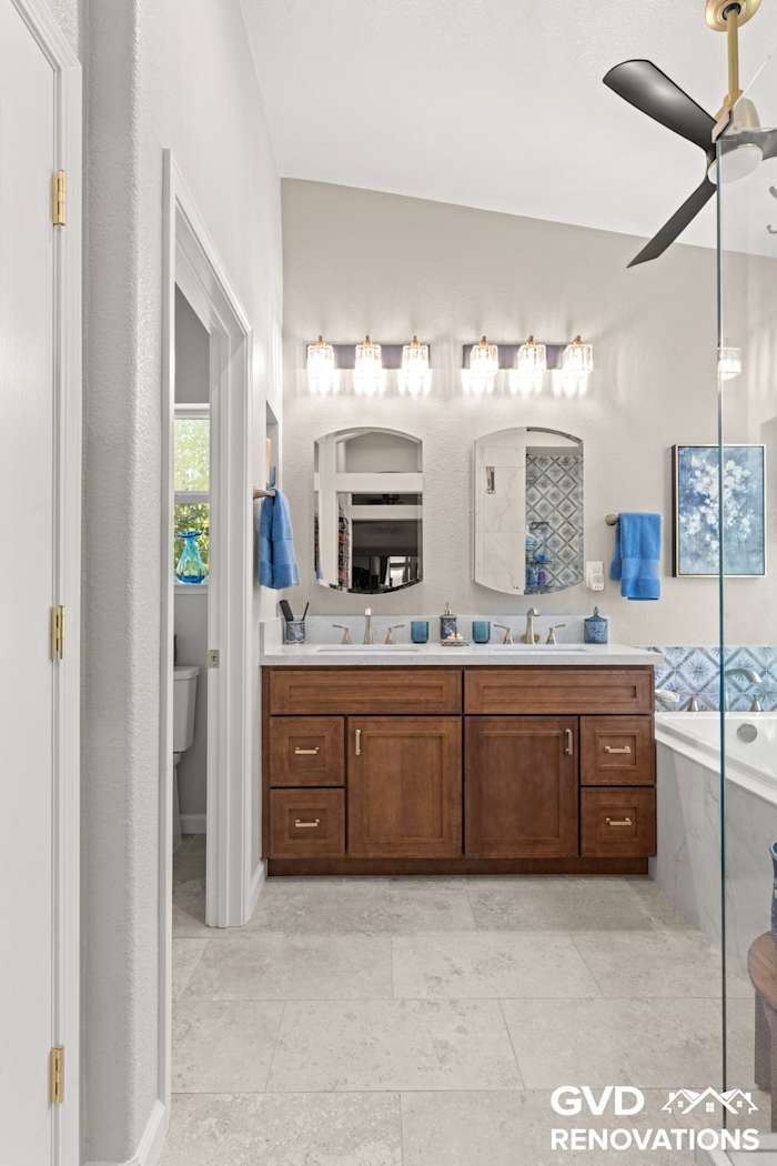 Bathroom vanity and mirror viewed from the entry doorway