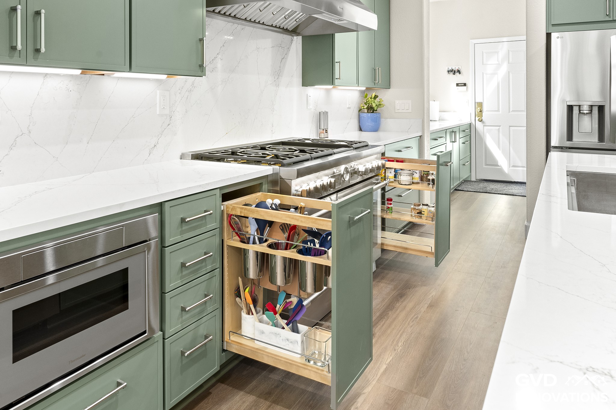Kitchen island with roll-out shelving and deep drawer storage shown open
