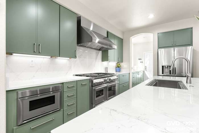 Range wall with a custom hood, microwave drawer and under-cabinet LED lighting